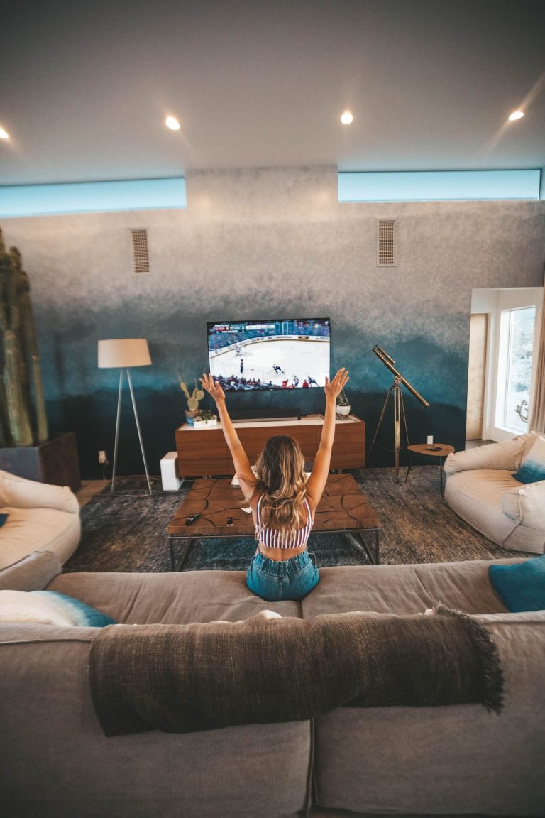 Viewer celebrating while watching live sport on IPTV